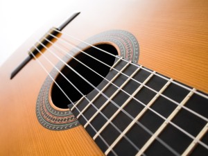 Acoustic guitar. Abstract background.